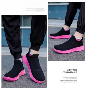Detail of breathable knit mesh sneakers with thick pink sole and elastic sock-style collar