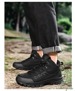 Close-up of black mid-top hiking boots featuring durable matte texture and anti-slip sole