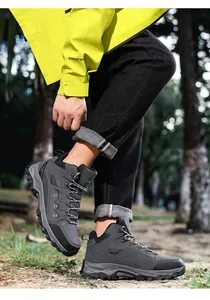 Detail shot of mid-cut hiking boots with non-slip rubber soles and durable laces