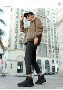 Outdoor street view of a man wearing a brown corduroy winter jacket and black boots