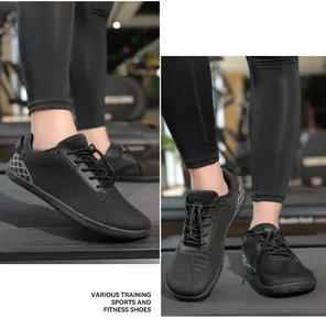 Detail of black breathable barefoot training shoes with elastic laces and honeycomb texture