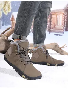 Macro shot of fleece lining and metal hooks on winter boots in snow background