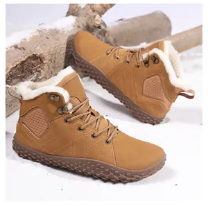 Detail of warm winter snow boot with thick faux fur lining and non-slip rubber sole on snow