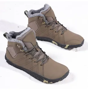 Detail of warm winter boots with plush gray lining and anti-slip rubber camouflage sole