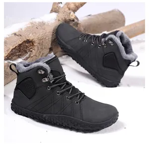 Detail of waterproof winter boots with thick fur lining and anti-slip rubber soles in snow