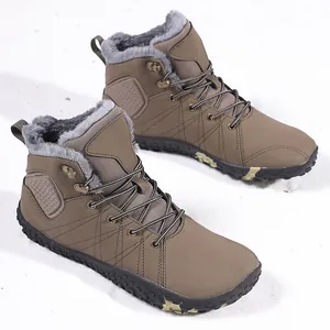 Detailed shot of brown winter snow boots with warm faux fur lining on fresh snow