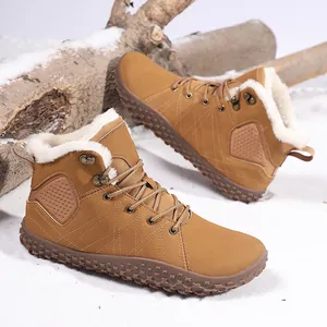 Close-up of brown snow boots with thick white faux fur lining and anti-slip rubber soles