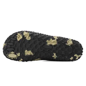 Macro view of anti-slip camouflage rubber sole with bionic five-finger design and lugs
