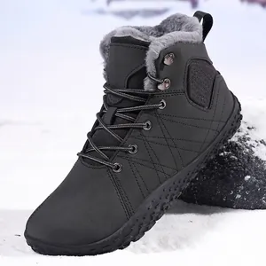 Winter snow boots for men and women with warm faux fur lining on a snowy outdoor landscape
