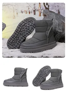 Vue détaillée de bottes de neige gris foncé avec tige matelassée et semelle antidérapante