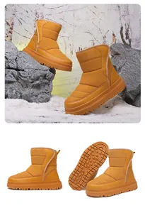 Vue détaillée des bottes de neige jaunes avec tissu matelassé et semelle à motif étoile