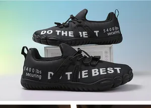 Detail of breathable black mesh water shoes featuring quick-lace system and rubber outsole