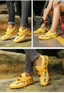 Detailed close-up of yellow water shoes featuring breathable mesh and anti-slip rubber soles