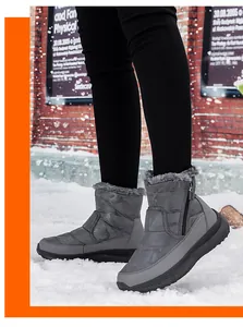 Makro-Detail von Camouflage-Schneestiefeln mit dickem Kunstfellfutter und Reißverschluss