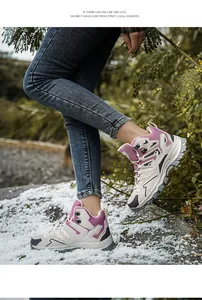 Close-up of women's high-top hiking boots with pink mesh and outdoor outsole design