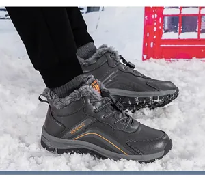 Close-up of winter snow boots with thick faux fur lining and drawstring closure in snow