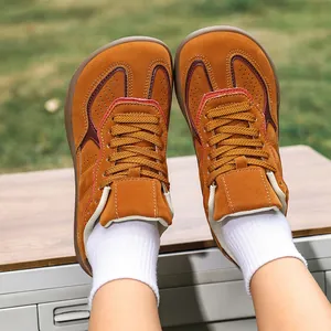 Brown suede outdoor hiking shoes with wide round toe and colorful leather stitching
