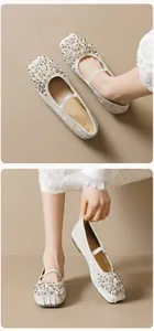 Macro detail of Mary Jane flats with luxury pearl and crystal beads on square toe