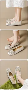 Detail of velvet ballet flats with pearls and rhinestones on square toe design