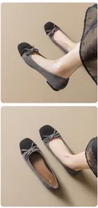 Detail of grey and black ballet flats with elegant bow and comfortable flat sole