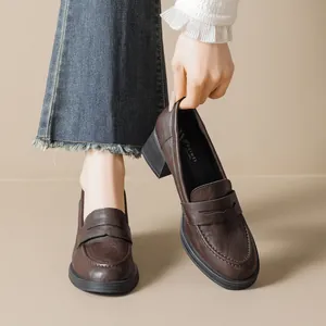 Retro dark brown platform penny loafers with thick square heels and leather finish