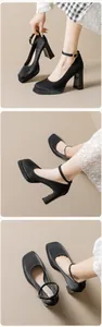 Detailed close-up of black platform Mary Jane shoes with thick heels and ankle straps