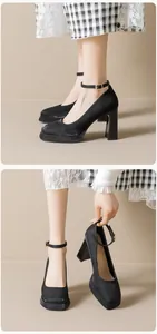 Close-up of black platform Mary Jane shoes featuring a square toe and ankle strap