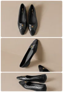 Detail view of black pointed-toe flats featuring gold rose buckle and material splicing