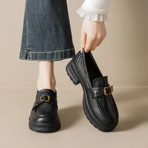 Classic black leather platform loafers for women with golden buckle and chunky lug sole