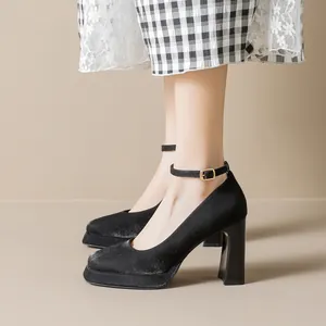 Elegant black Mary Jane platform pumps with chunky high heels and ankle straps