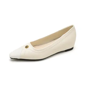 Elegant pointed toe wedges for women featuring cream leather and gold rose ornament