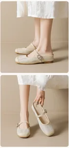 Detailed view of beige woven Mary Jane mules with adjustable strap and metal buckle