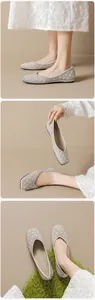 Detail of pointed flat shoes featuring quilted patterns with faux pearls and rhinestones