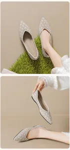 Detailed macro shot of pointed-toe flats with pearl embellishments and diamond quilting