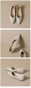 Detail view of pointed-toe flat shoes with pearl embellishments and diamond quilting