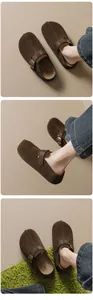 Detail view of brown suede mule clogs with adjustable metal buckles and stitching