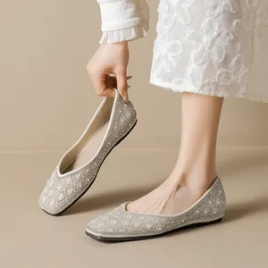 Elegant pointed-toe flat shoes for women with rhinestones and pearls in beige