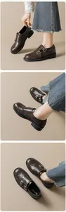 Detailed view of dark brown Brogue loafers featuring double monk straps and platform soles
