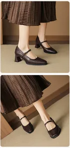Detailed close-up of dark brown leather Mary Jane shoes with vintage square toe and block heel