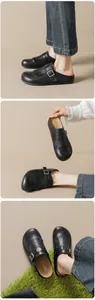 Close-up of vintage black mules with fringe details, tassels, and brogue perforation