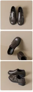 Detail of dark brown leather monk strap loafers with brogue wingtip carving and thick soles