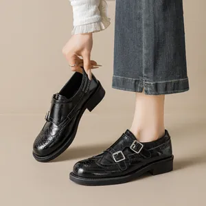 Women's black brogue monk strap loafers with glossy patent leather and platform soles