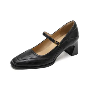 Classic black leather Mary Jane shoes with square toe, chunky heel and gold buckle detail