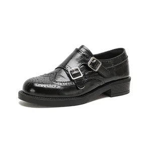 Women's black Brogue monk strap shoes with chunky soles and silver metal buckles