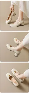 Detail of beige block heel Mary Jane shoes with elegant gold rose metal buckle