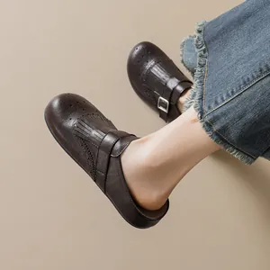 Retro dark brown leather mule with fringe tassel detail and vintage brogue style