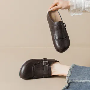 Dark brown leather fringe mules with vintage brogue carving and silver buckles