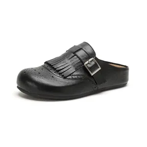 Retro black leather tassel mule with brogue detailing and silver buckle finish