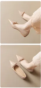 Detailed macro view of nude pointed-toe flat shoes with glossy finish and delicate bow