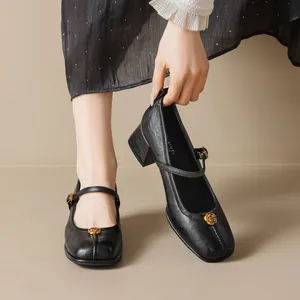 Elegant black Mary Jane heels with gold rose ornament and vintage block heel design